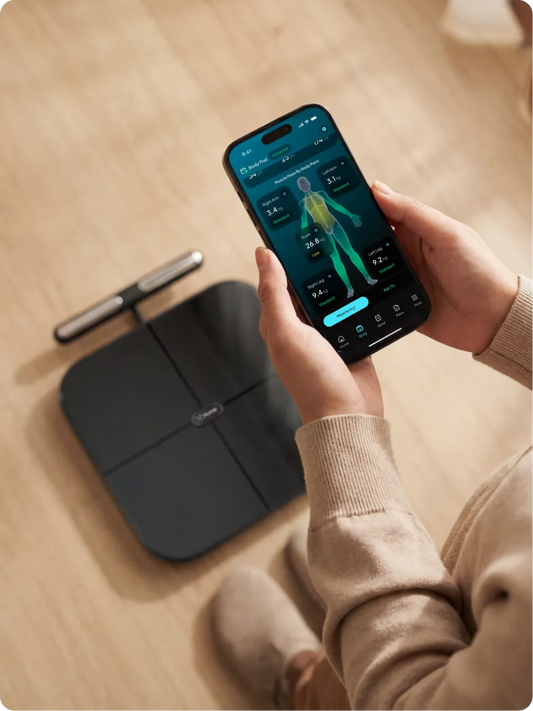 woman tracking body fat and composition with hume body pod