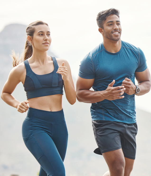Man and woman jogging outdoors wearing Hume Bands, highlighting fitness tracking, endurance, and active lifestyle.